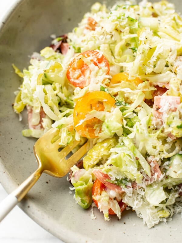 a bowl of italian chopped salad with fork