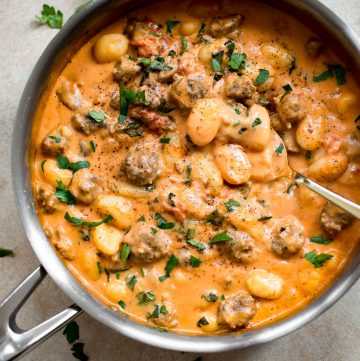 This one pan creamy gnocchi with sausage recipe is an easy, quick, and incredibly delicious comfort food meal. Ready in 30 minutes!