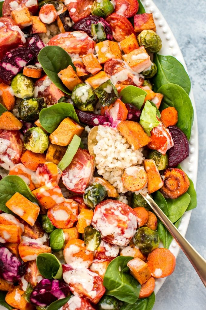 close-up of roasted vegetable salad with spoon