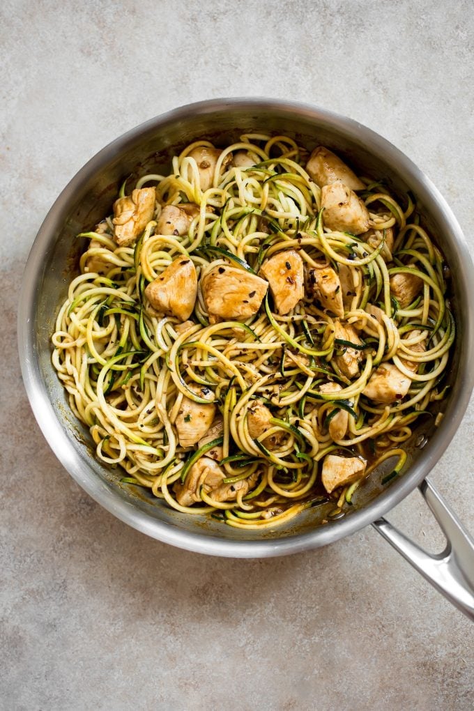 sweet and spicy chicken zucchini noodles in a skillet