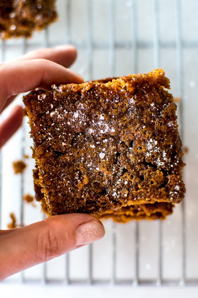 female hand holding an easy vegan gingerbread bar