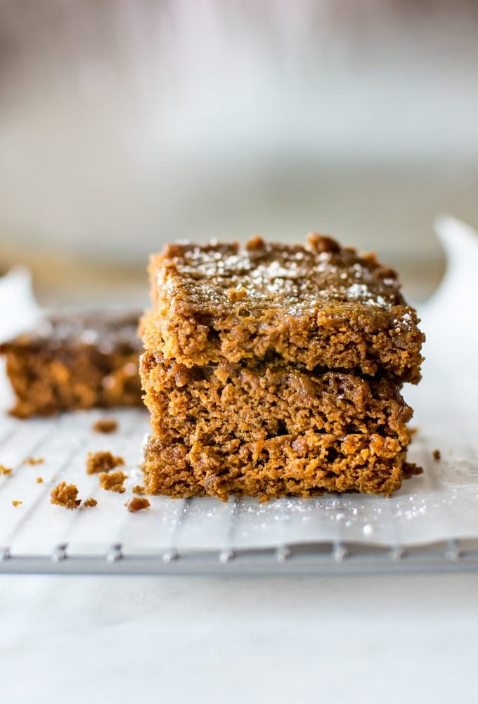 stack of vegan gingerbread bars on a wire rack