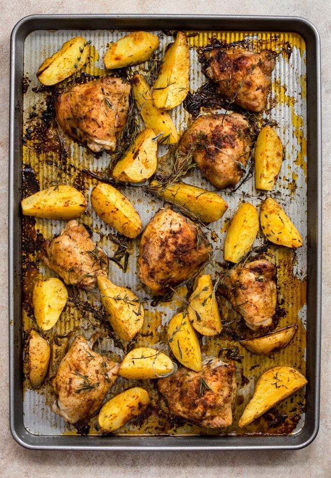 sheet pan with baked chicken and potatoes