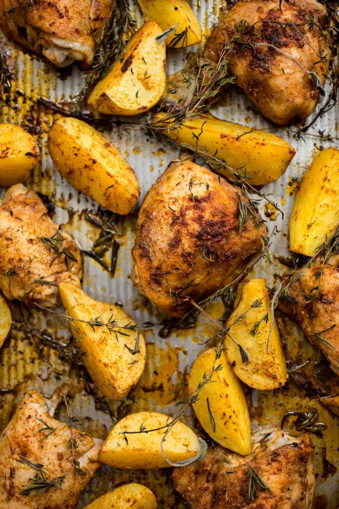 close-up of baked potato wedges and chicken