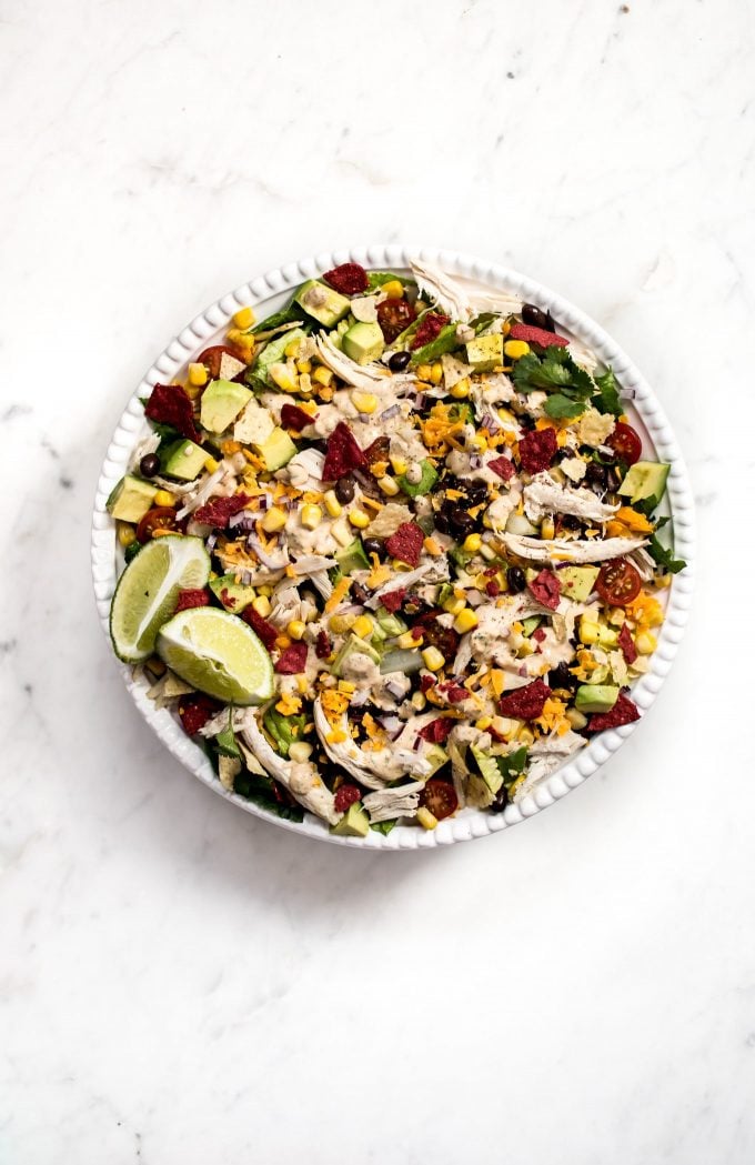 healthy chicken taco salad on a plate on a marble surface