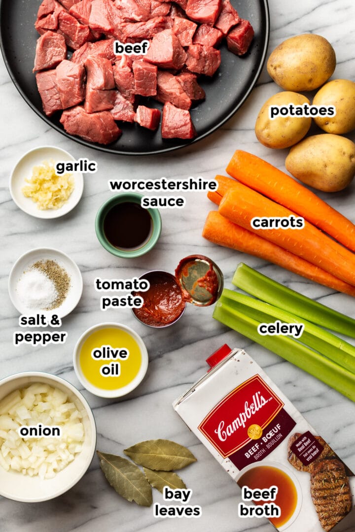 ingredients for slow cooker beef stew on a countertop