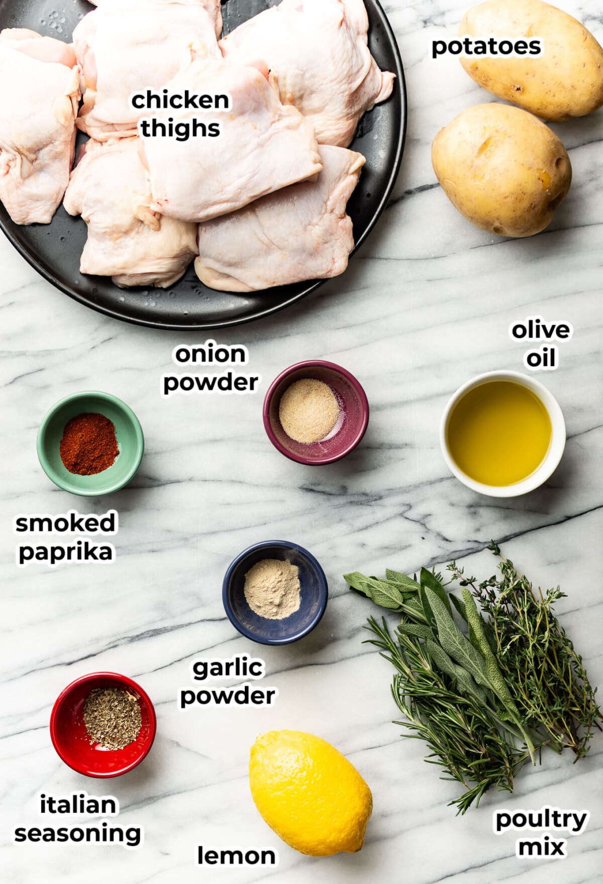 ingredients for sheet pan chicken and potatoes in prep bowls