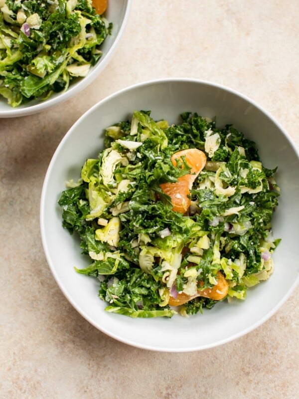 This easy shredded kale and Brussels sprouts salad is the perfect winter salad recipe. Mandarin oranges and pecorino cheese make it extra delicious.