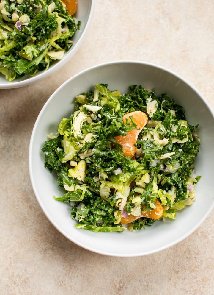 This easy shredded kale and Brussels sprouts salad is the perfect winter salad recipe. Mandarin oranges and pecorino cheese make it extra delicious.