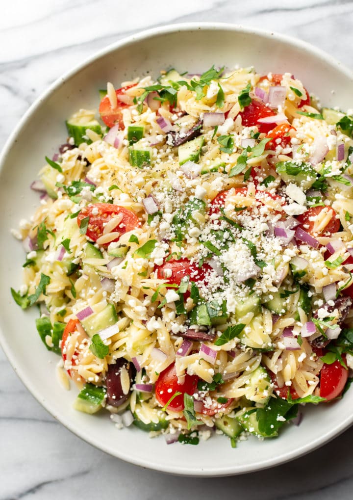 a bowl of mediterranean orzo salad