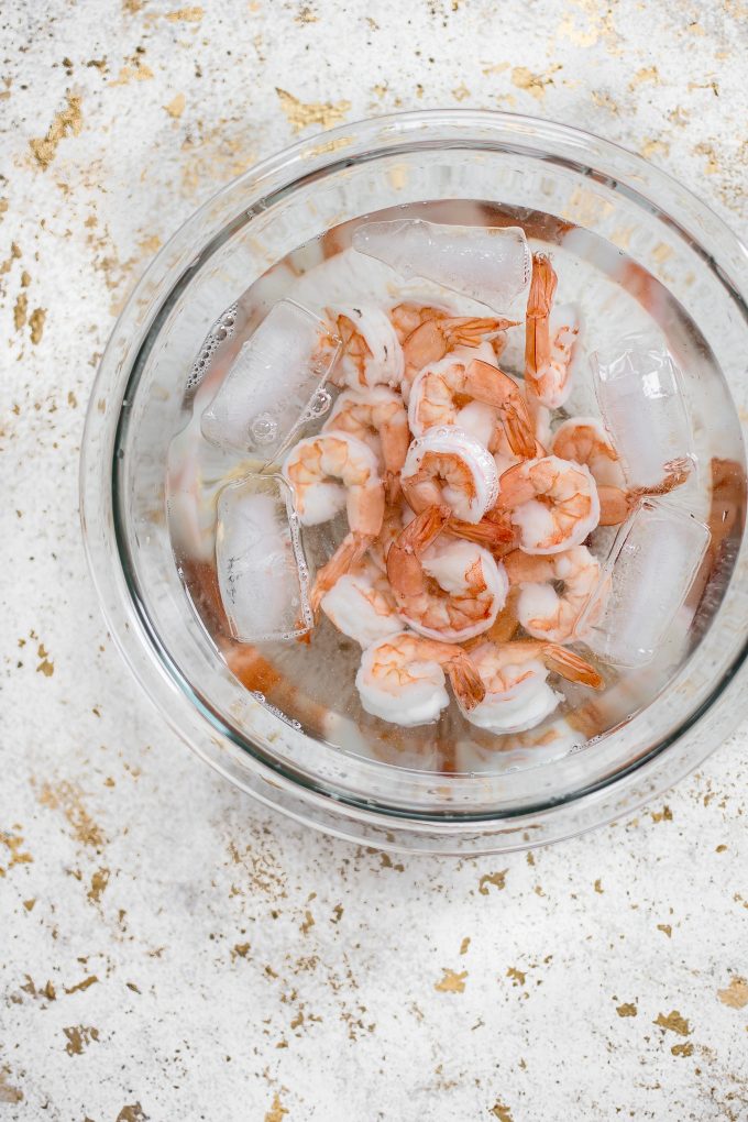 glass bowl with raw shrimp
