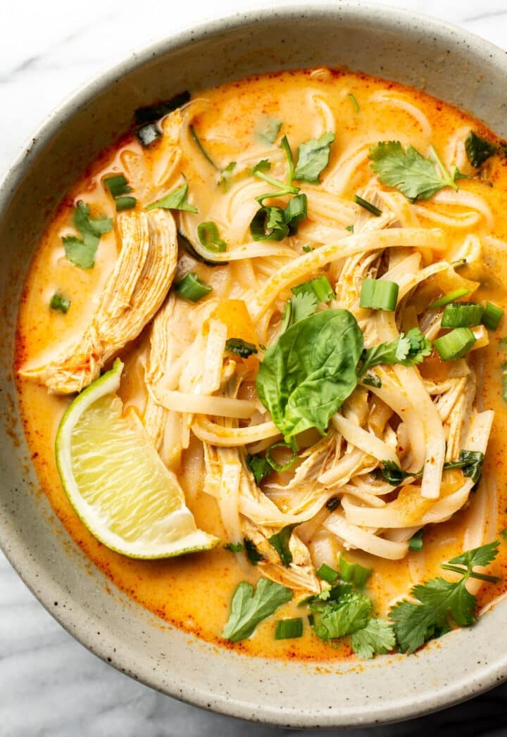 a bowl of thai chicken curry soup