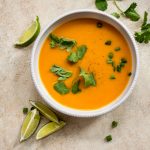 Thai butternut squash coconut curry soup in a white bowl