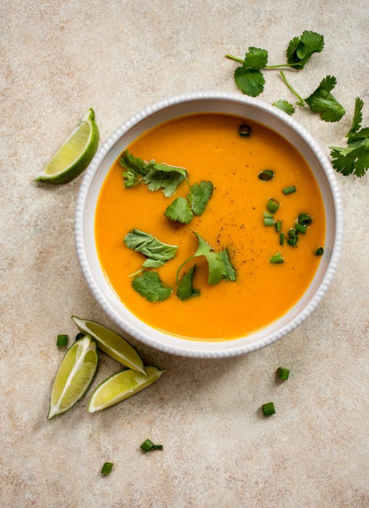 Thai butternut squash coconut curry soup in a white bowl