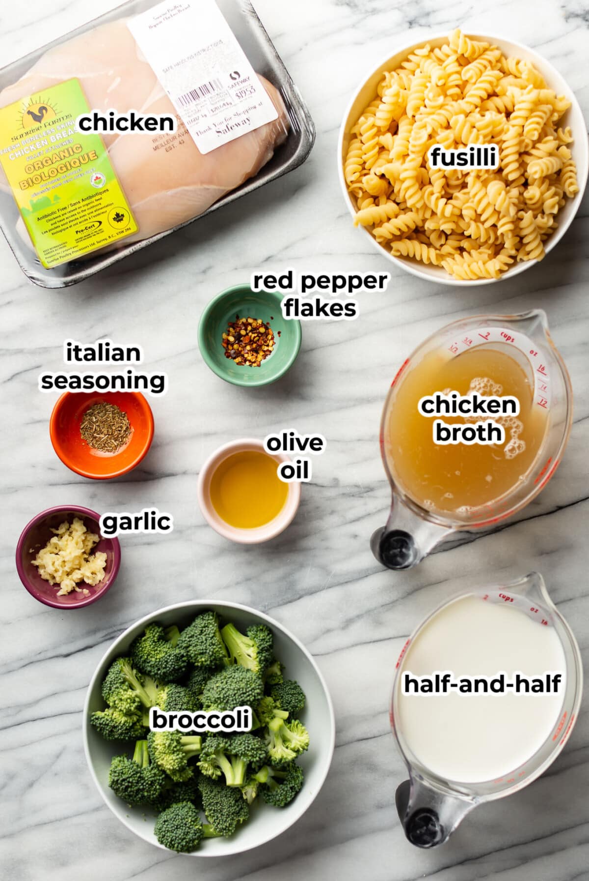 ingredients for chicken and broccoli pasta in prep bowls