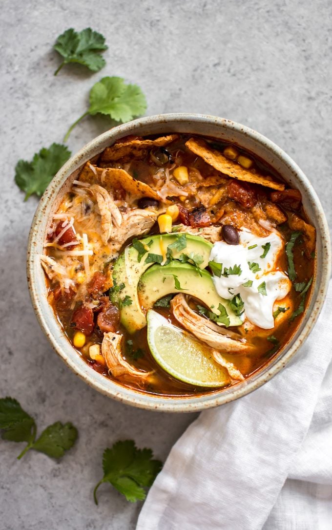 easy Instant Pot chicken tortilla soup with suggested toppings in a bowl