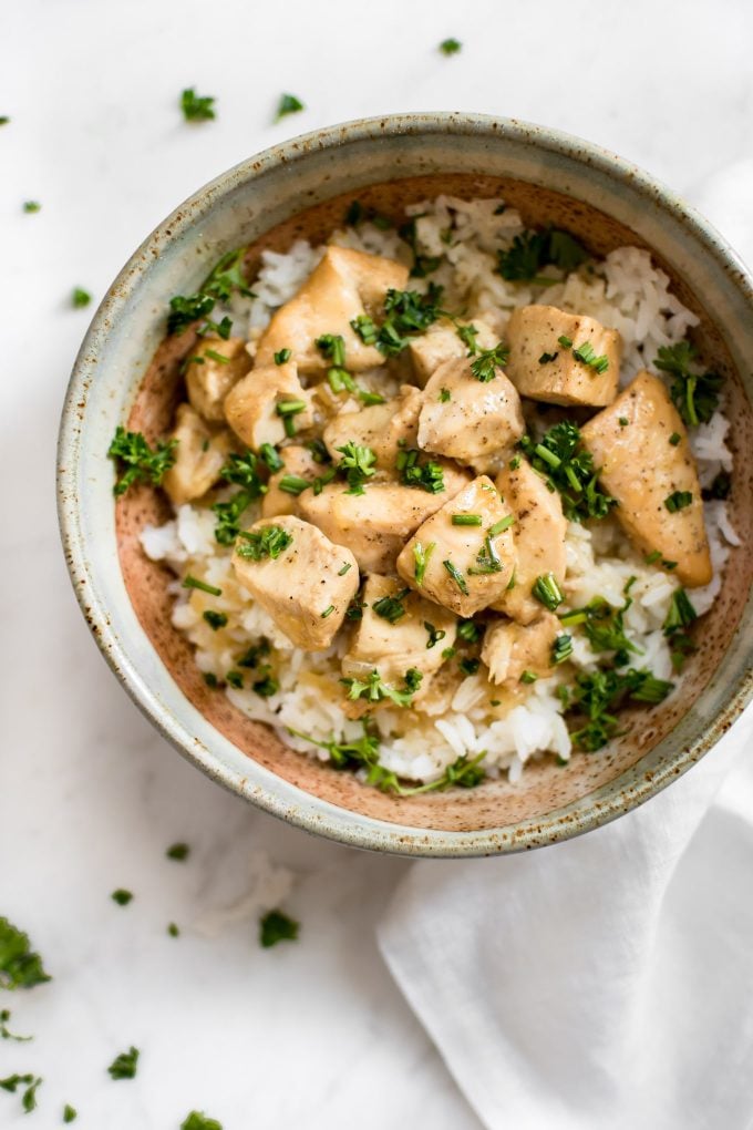 Instant Pot honey garlic chicken in a bowl over rice