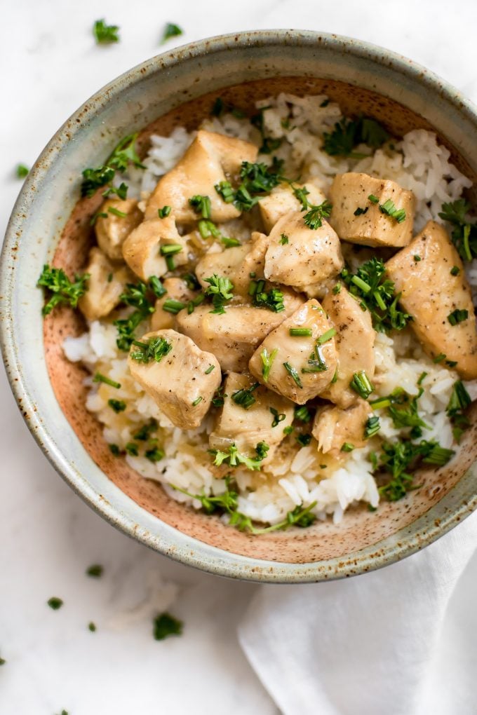 close-up of easy Instant Pot honey garlic chicken served over rice in a bowl