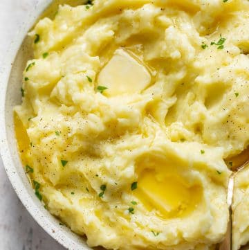close-up of creamy Instant Pot mashed potatoes with pools of melted butter