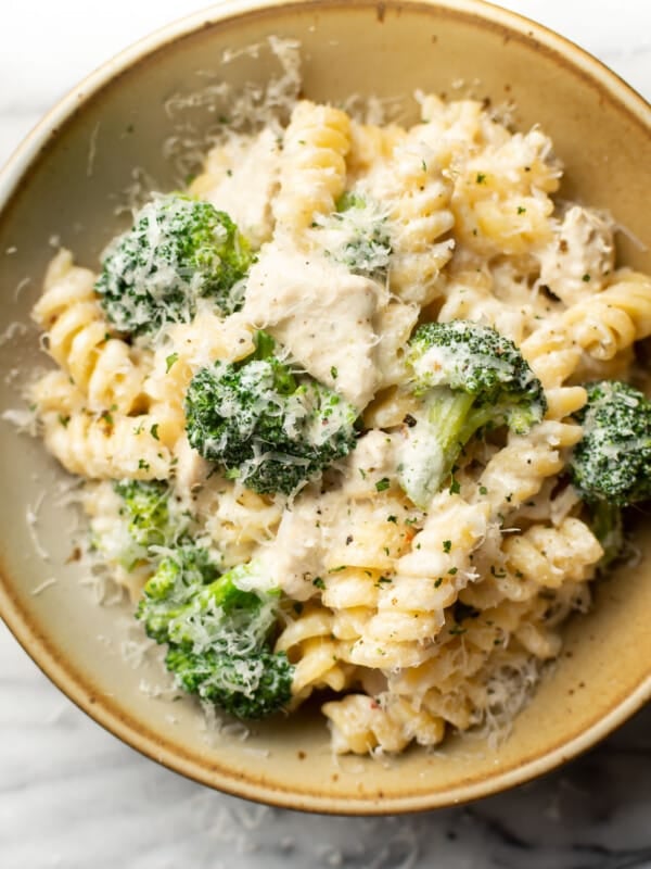 a bowl of chicken and broccoli pasta