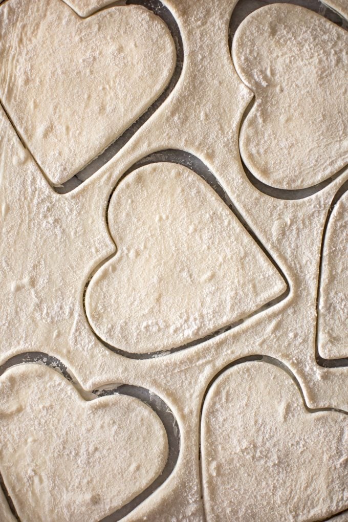 close-up of heart shape cookie cut puff pastry batter