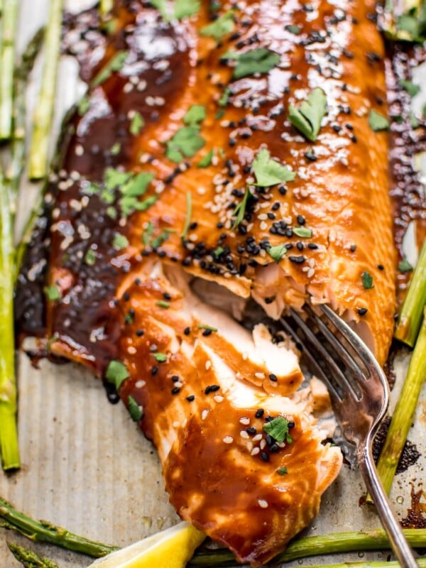 This quick and easy sheet pan salmon and asparagus makes a delicious dinner! The sweet hoisin sauce glaze will have everyone asking for seconds!