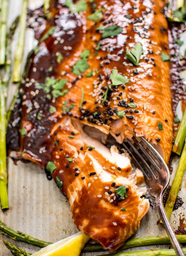This quick and easy sheet pan salmon and asparagus makes a delicious dinner! The sweet hoisin sauce glaze will have everyone asking for seconds!
