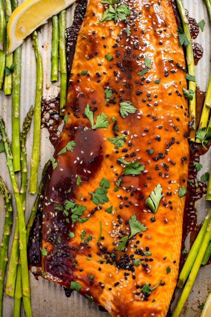 close-up of hoisin glazed salmon and asparagus on sheet pan