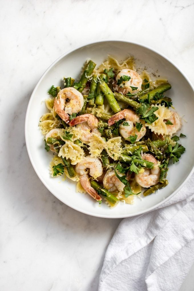 shrimp asparagus pasta on a white plate