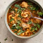 This turkey meatball soup is hearty, filling, and delicious! Tender turkey meatballs, pasta, and fresh herbs in a tomato broth make this one tasty soup.