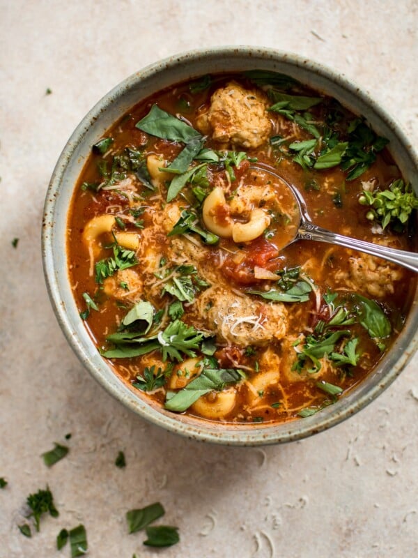 This turkey meatball soup is hearty, filling, and delicious! Tender turkey meatballs, pasta, and fresh herbs in a tomato broth make this one tasty soup.