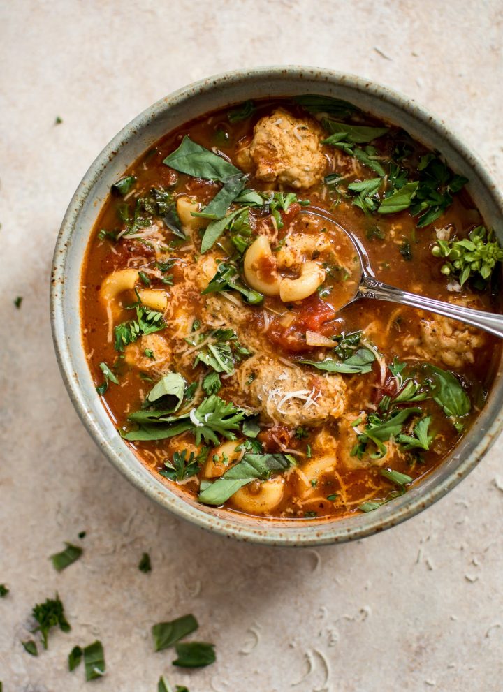 This turkey meatball soup is hearty, filling, and delicious! Tender turkey meatballs, pasta, and fresh herbs in a tomato broth make this one tasty soup.