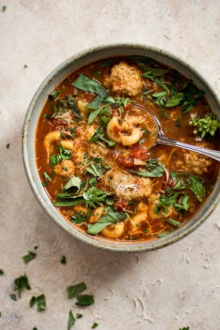 This turkey meatball soup is hearty, filling, and delicious! Tender turkey meatballs, pasta, and fresh herbs in a tomato broth make this one tasty soup.