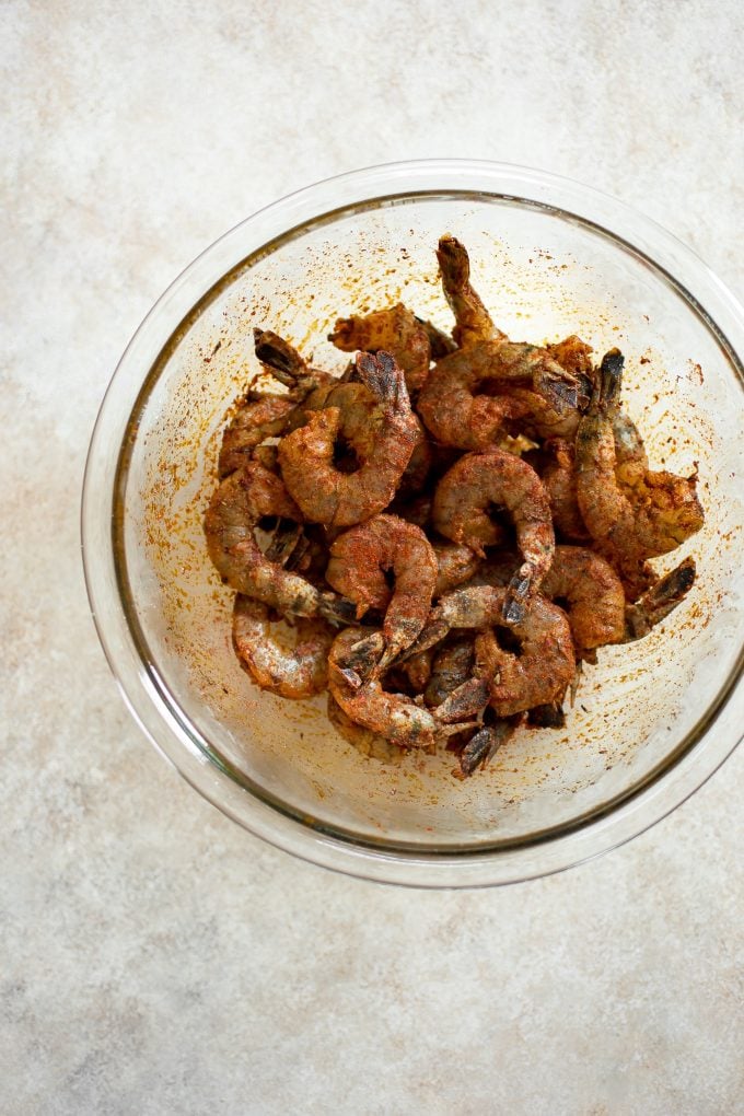 glass bowl with seasoned raw shrimp