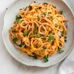 This 20 minute vegetarian creamy mushroom sweet potato noodles recipe is a healthy vegetarian spiralized sweet potato recipe. This recipe will quickly show you how to make sweet potato noodles! The simple garlicky mushroom Alfredo sauce is delicious!