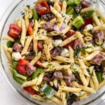 This Italian pasta salad recipe is healthy, fast, and easy to make! It's the best classic cold pasta salad for summer BBQs, picnics, or potlucks. A tangy vinaigrette, salami, mozzarella, and fresh herbs make this one delicious side dish! Feeds a crowd.