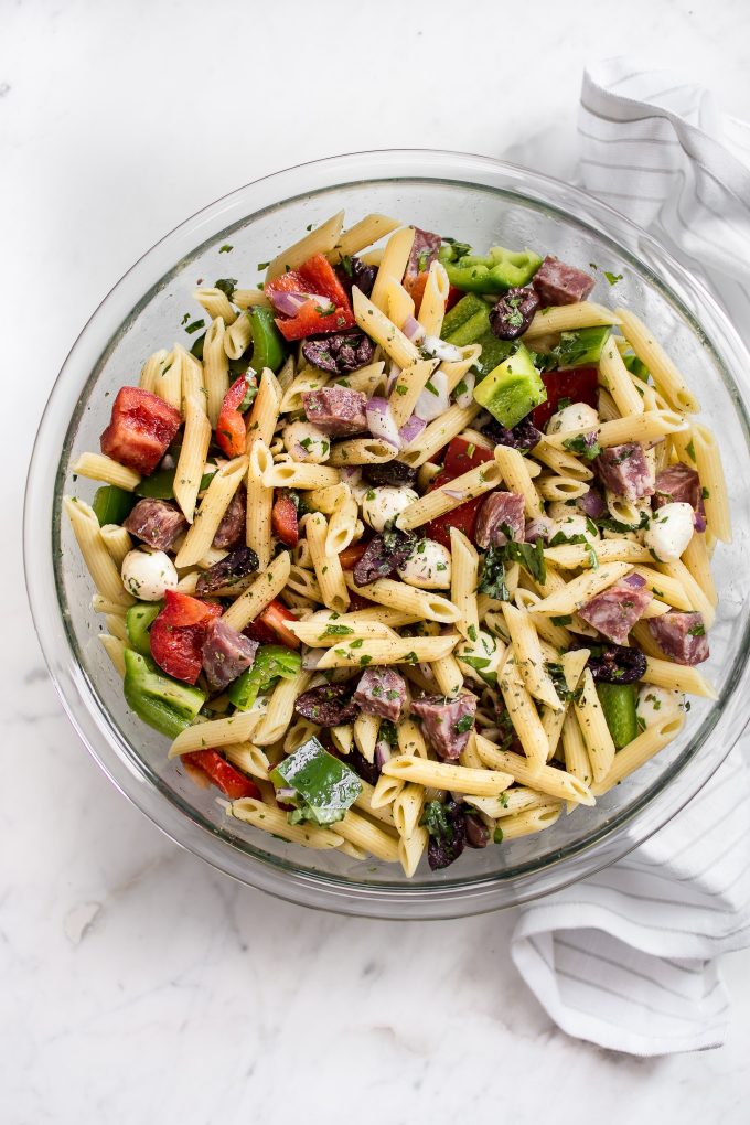 healthy Italian pasta salad in a glass serving bowl
