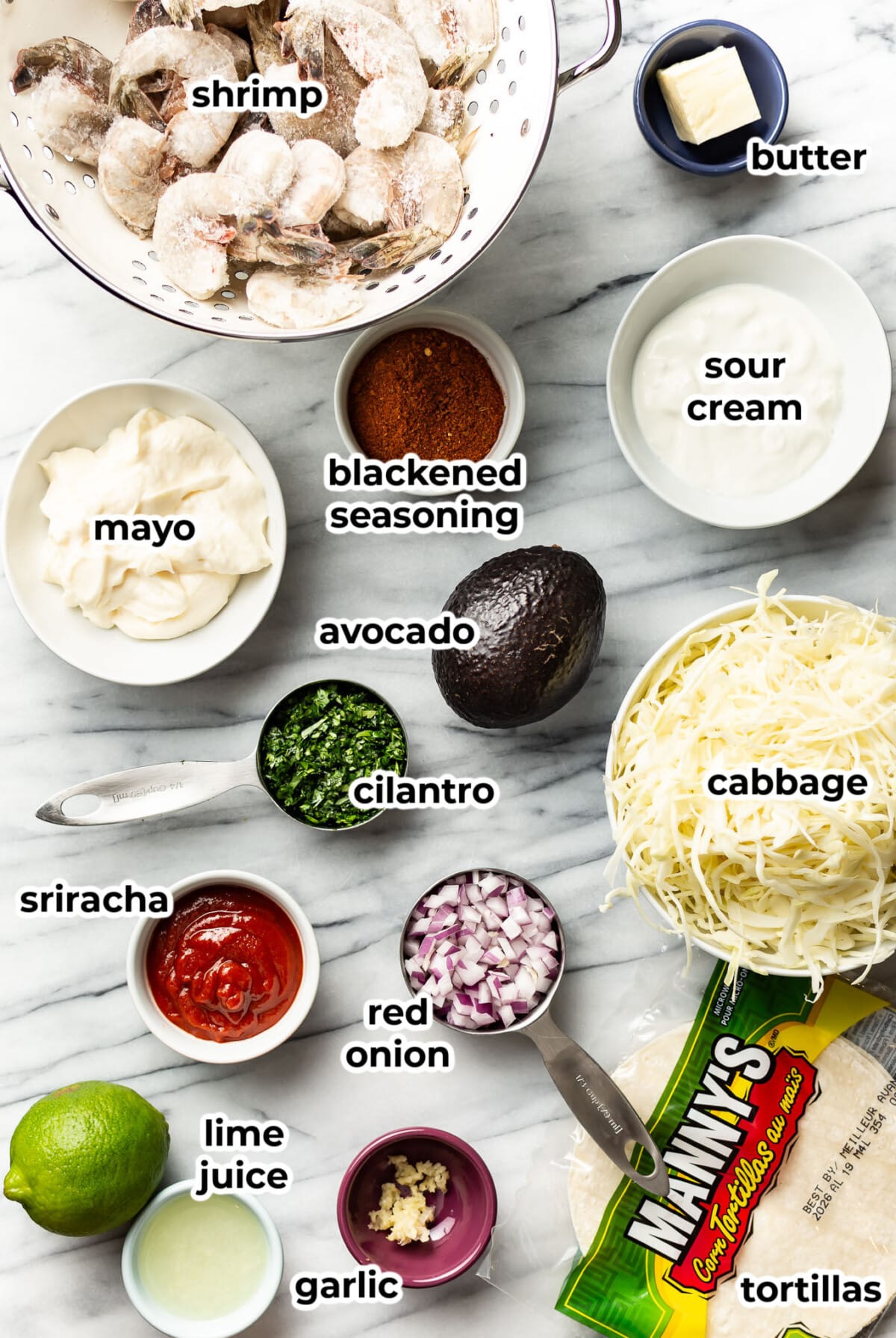 ingredients for blackened shrimp tacos in prep bowls
