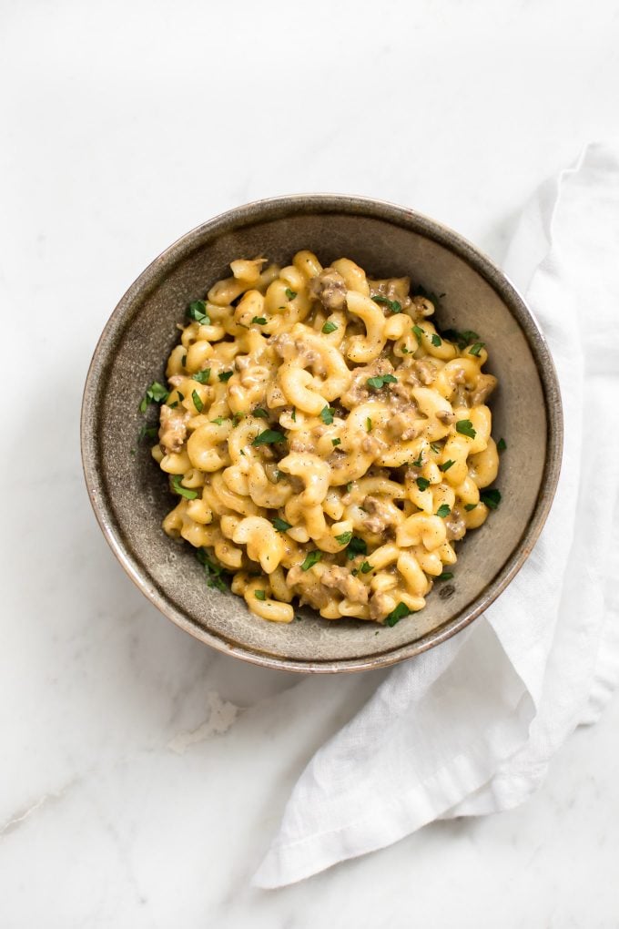 bowl of Instant Pot beef mac and cheese with a cloth napkin