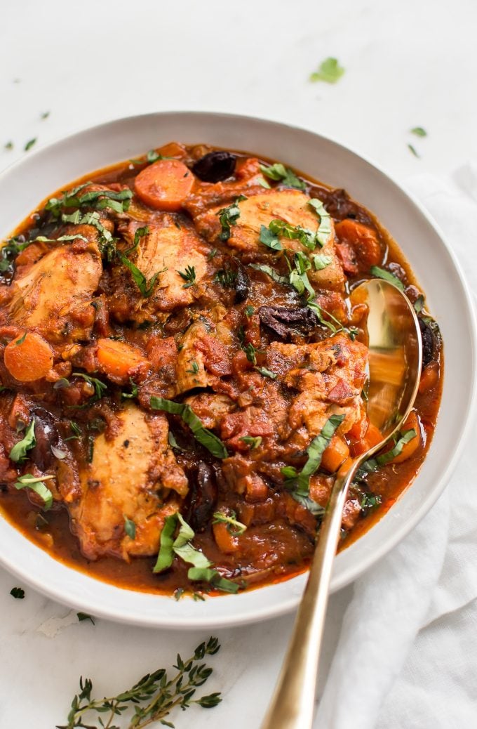 close-up of Instant Pot chicken cacciatore in a bowl with a spoon