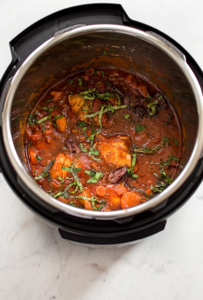 ingredients for chicken cacciatore inside an Instant Pot electric pressure cooker