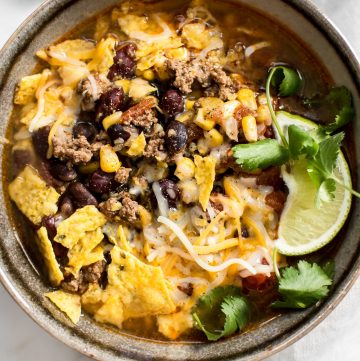 This Instant Pot taco soup recipe is healthy, hearty, and delicious. Add your favorite toppings and it makes a fantastic meal!