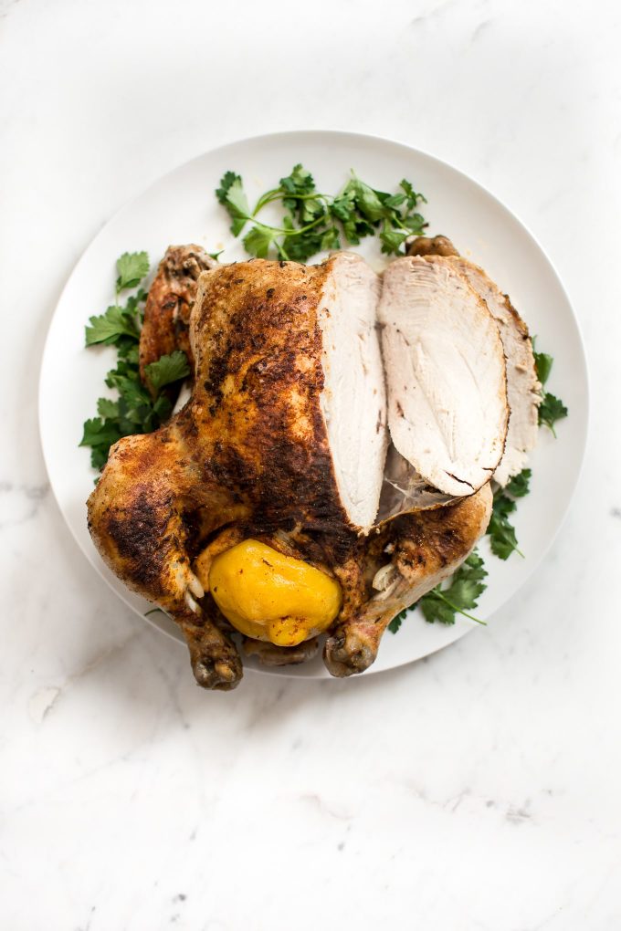 sliced whole chicken from an Instant Pot on a serving plate