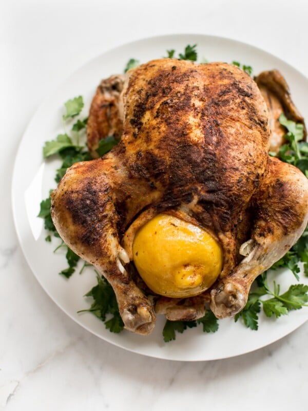 This easy Instant Pot whole chicken recipe is fast, simple, healthy, and makes the best tender chicken. This electric pressure cooker whole chicken is great for a family dinner or to have chicken meat ready for meals throughout the week! The chicken can be stuffed with lemon for extra flavor. Use the leftovers to make stock or bone broth. You can even use frozen chicken in this recipe.