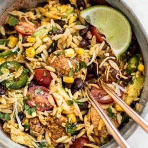 This Mexican chicken salad with orzo is fresh, healthy, and loaded with delicious Tex-Mex flavors including avocado and a delicious cilantro lime dressing! Quick and easy and ready in only 30 minutes - perfect for lunches, weeknight dinners, or potlucks.