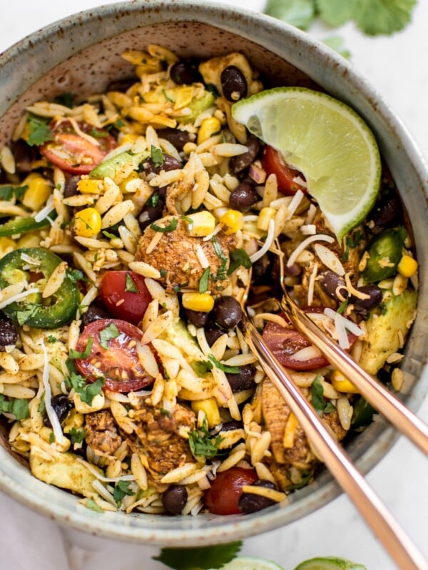 This Mexican chicken salad with orzo is fresh, healthy, and loaded with delicious Tex-Mex flavors including avocado and a delicious cilantro lime dressing! Quick and easy and ready in only 30 minutes - perfect for lunches, weeknight dinners, or potlucks.