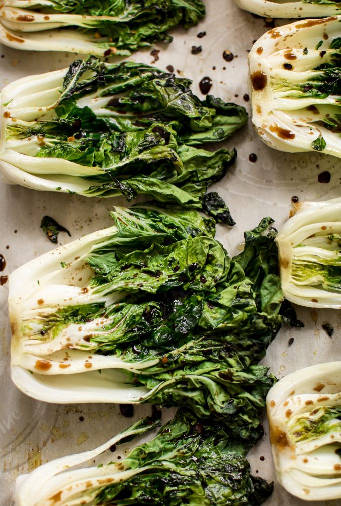 close-up of vegan roasted baby bok choy with spicy chili flakes and soy sauce glaze