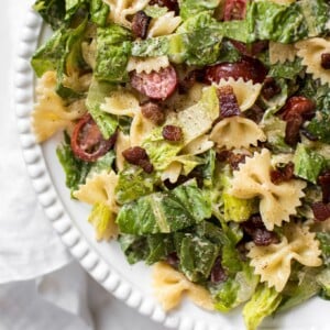 This easy BLT bowtie pasta salad recipe has crispy bacon and a delicious creamy smoky dressing that will have everyone wanting seconds! Perfect for summer BBQs, picnics, or potlucks. Feeds a crowd!