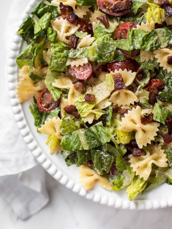 This easy BLT bowtie pasta salad recipe has crispy bacon and a delicious creamy smoky dressing that will have everyone wanting seconds! Perfect for summer BBQs, picnics, or potlucks. Feeds a crowd!