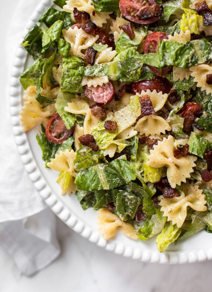 This easy BLT bowtie pasta salad recipe has crispy bacon and a delicious creamy smoky dressing that will have everyone wanting seconds! Perfect for summer BBQs, picnics, or potlucks. Feeds a crowd!